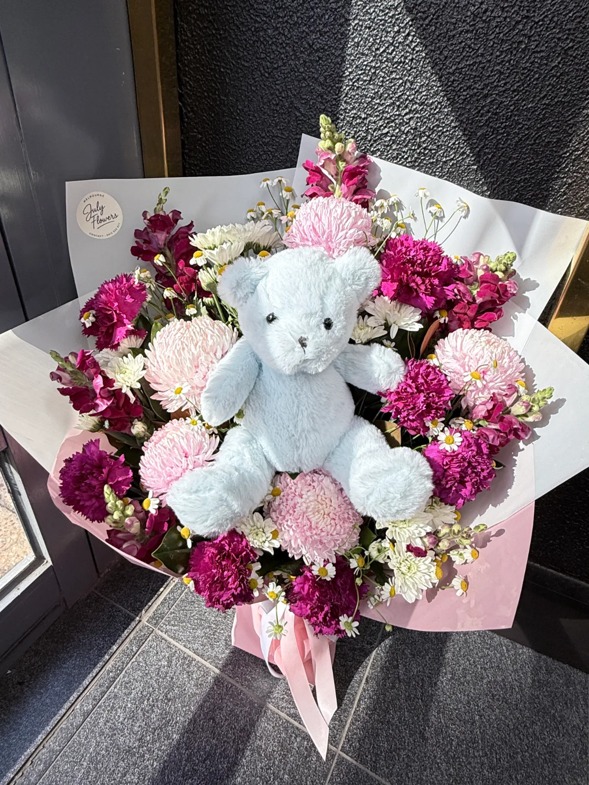 Teddy Bear Romance — complete hand-tied bouquet in ivory wrapping